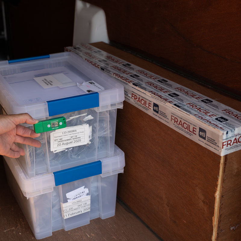 A HumidityPod near clear plastic storage boxes