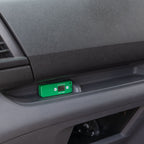 A HumidityPod on a grey dashboard of a vehicle.