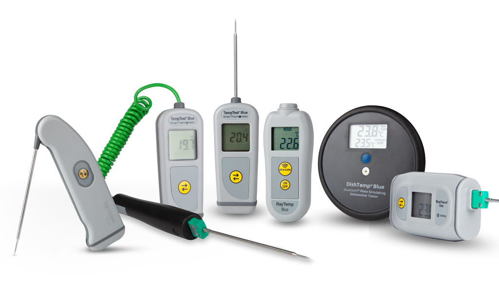 Collection of digital thermometers and temperature probes on a white background