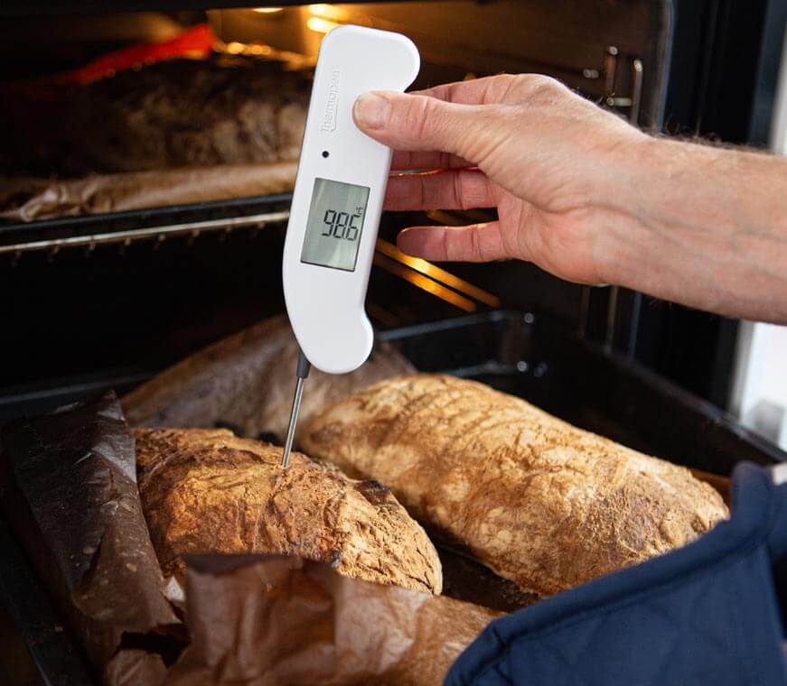 Thermapen ONE testing temperature of bread coming out of an oven