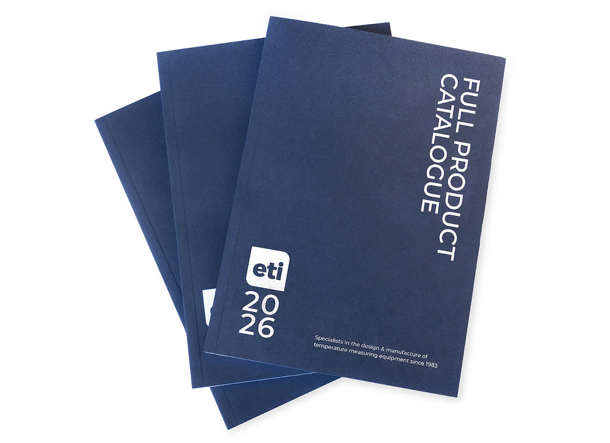 'Full Product Catalogue' booklets with ETI branding on a white background