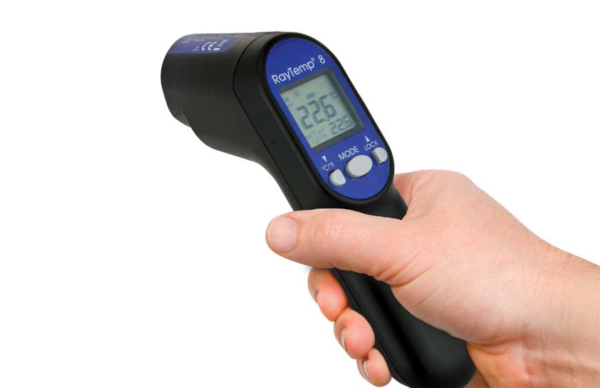 Hand holding a RayTemp 8 infrared thermometer on a white background