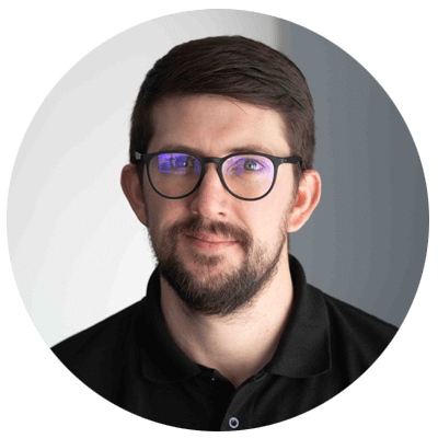 Man wearing glasses with a neutral background