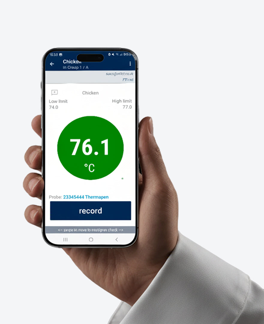 Hand holding a smartphone displaying a temperature app with a green circle showing 76.1°C.