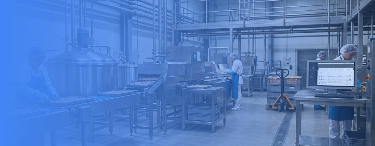 Factory interior with workers and machinery, blue filter applied