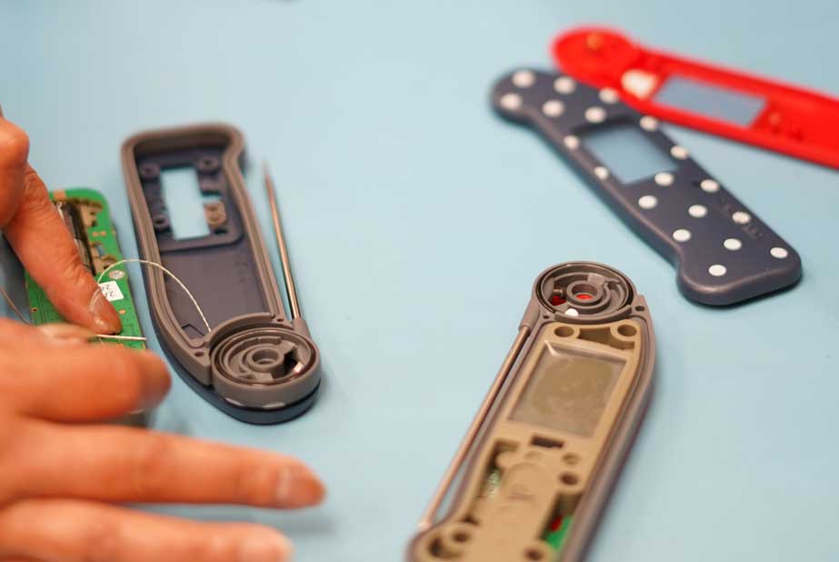 Custom printed Thermapen ONE cases with Polka Dot design being assembled