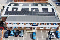 Drone view of ETI factory with solar panels on the roof