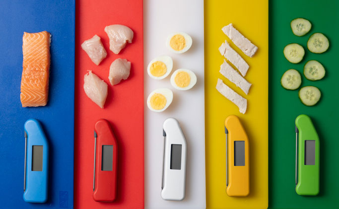 Thermapen Classic food safe colours on colour coded chopping boards indicating what food safe items the colourd are for